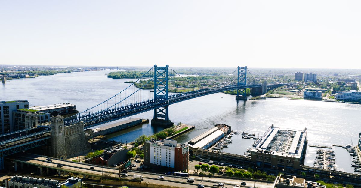Stunning aerial shot of Benjamin Franklin Bridge spanning the Delaware River in Philadelphia, Pennsylvania.